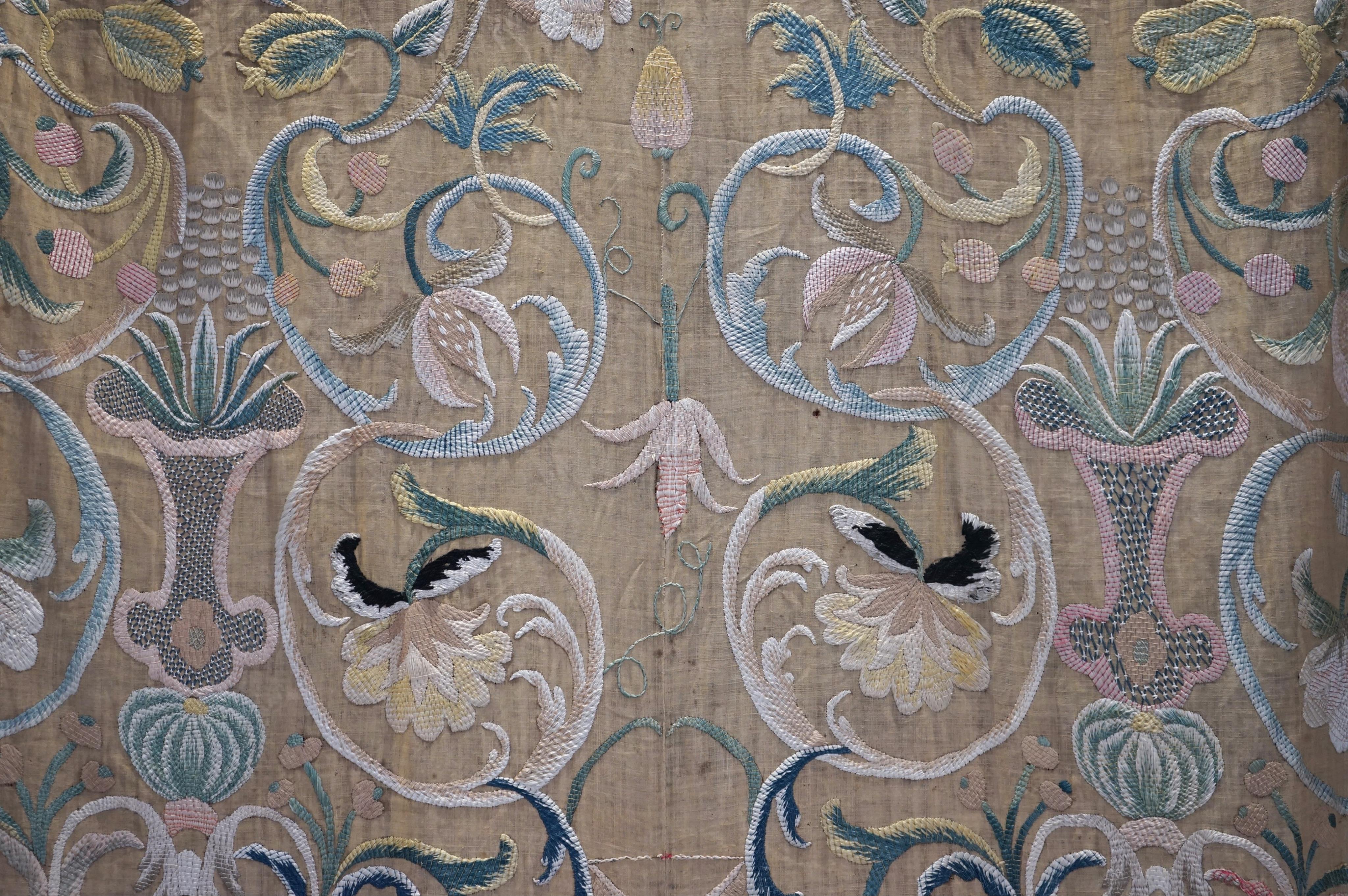 A large pair and one smaller panel of late 18th century Italian silk floss hand embroidered panels, possibly from Florence or Venice, both known for floss embroidery. Thought to be originally sacristy hangings. Elaborate